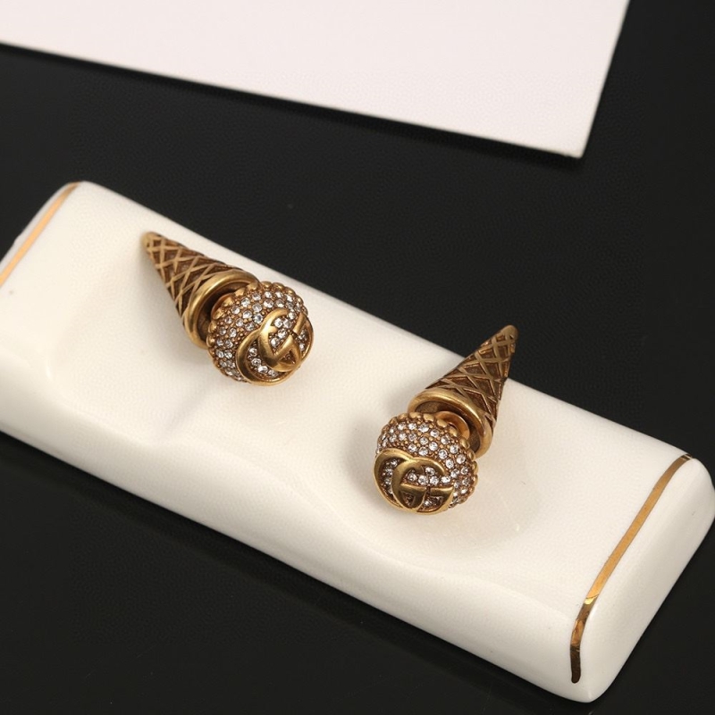 G*u*i earrings